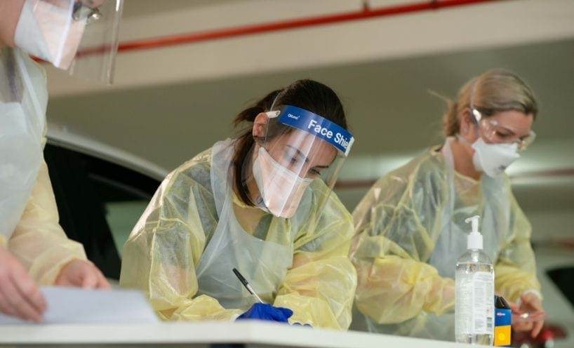 Healthcare workers in personal protective equipment (PPE) Healthcare workers in personal protective equipment (PPE)