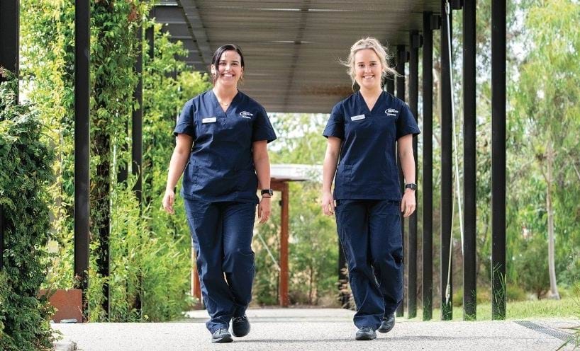 Two nurses walking outside in regional Victoria Two nurses walking outside in regional Victoria